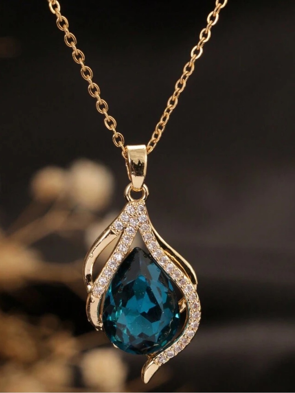 Gold Teardrop Pendant Necklace with Deep Blue Gem
